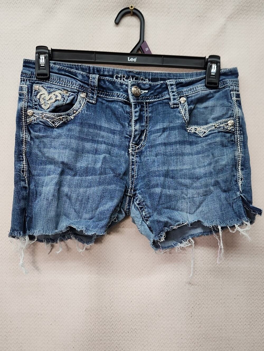Grace Distressed Blue Denim Cutoff Shorts with Embroidered Pockets